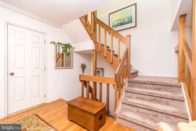 a living room with furniture and painting on the wall