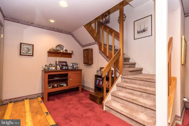 a living room with furniture and painting on the wall