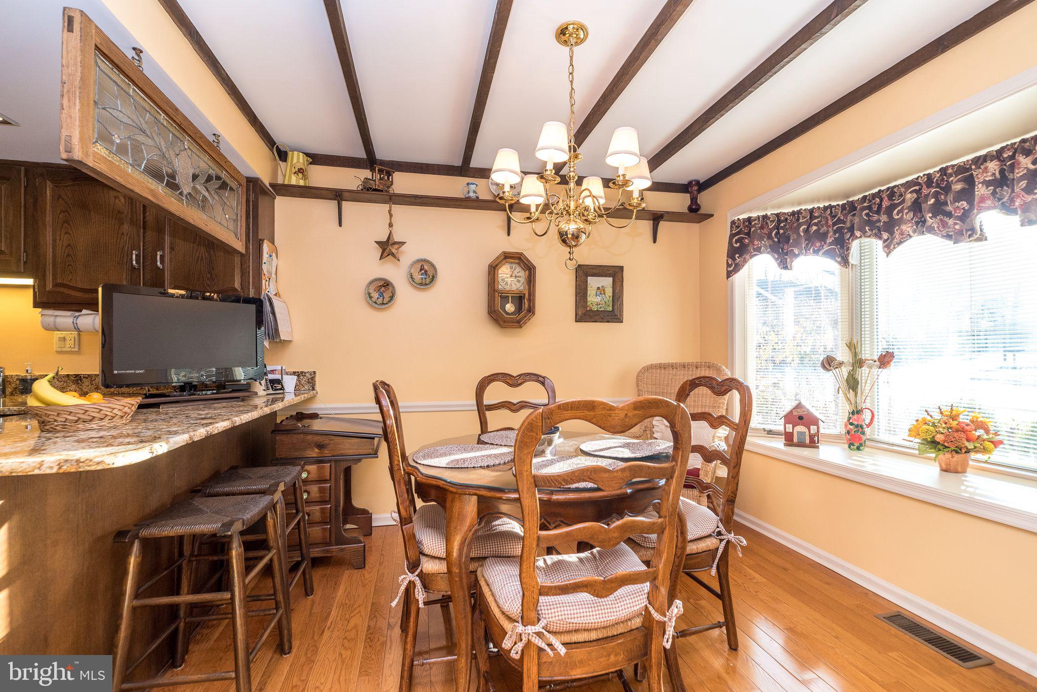 68 Amity Drive Chesterbrook, PA 19087 - Photo 10 of 62 a view of a dining room with furniture and a chandelier
