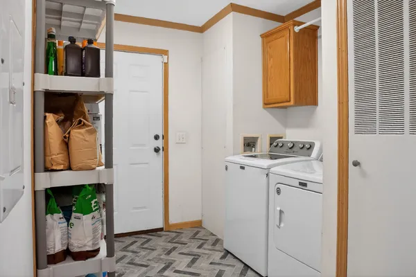 a bedroom with a bed chair and a desk