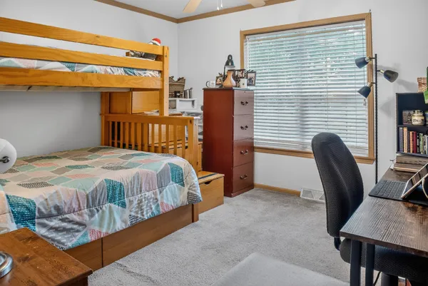 a view of a livingroom with furniture wooden floor and a floor to ceiling window