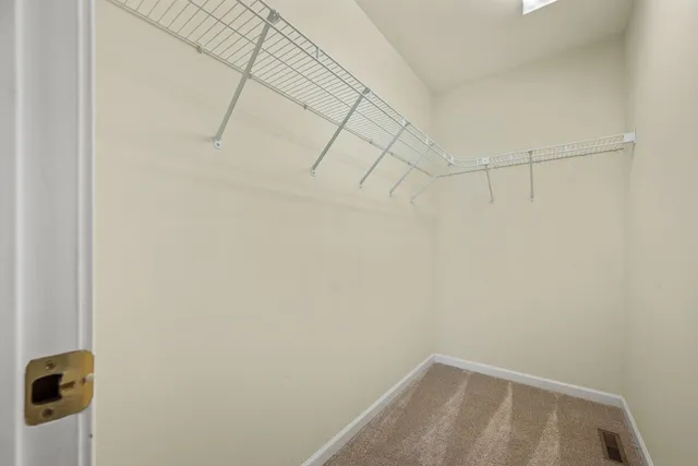 a bathroom with a sink a mirror and a shower