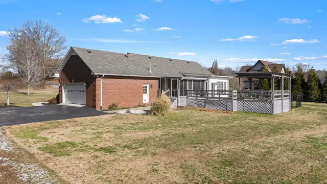 an aerial view of a house with swimming pool and outdoor space
