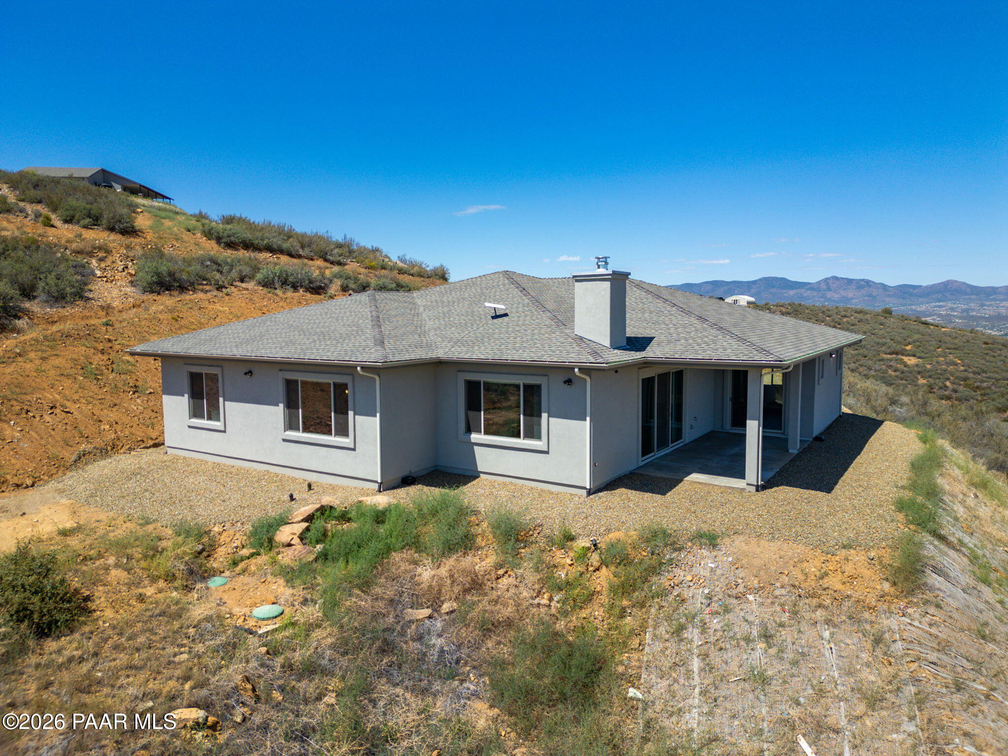 15690 East Orchard View Road Dewey, AZ 86327 - Photo 17 of 26 a front view of a house with a yard