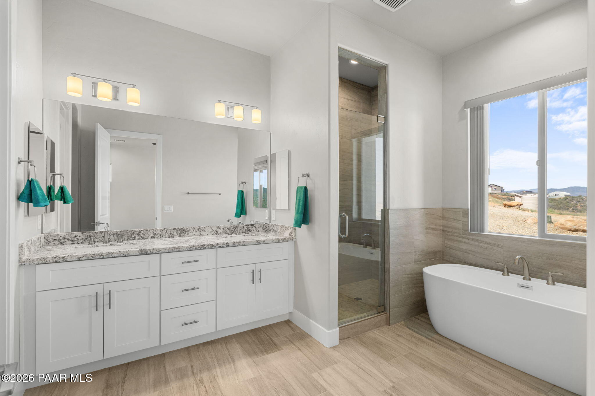 15690 East Orchard View Road Dewey, AZ 86327 - Photo 20 of 26 a bathroom with a granite countertop sink and a bathtub