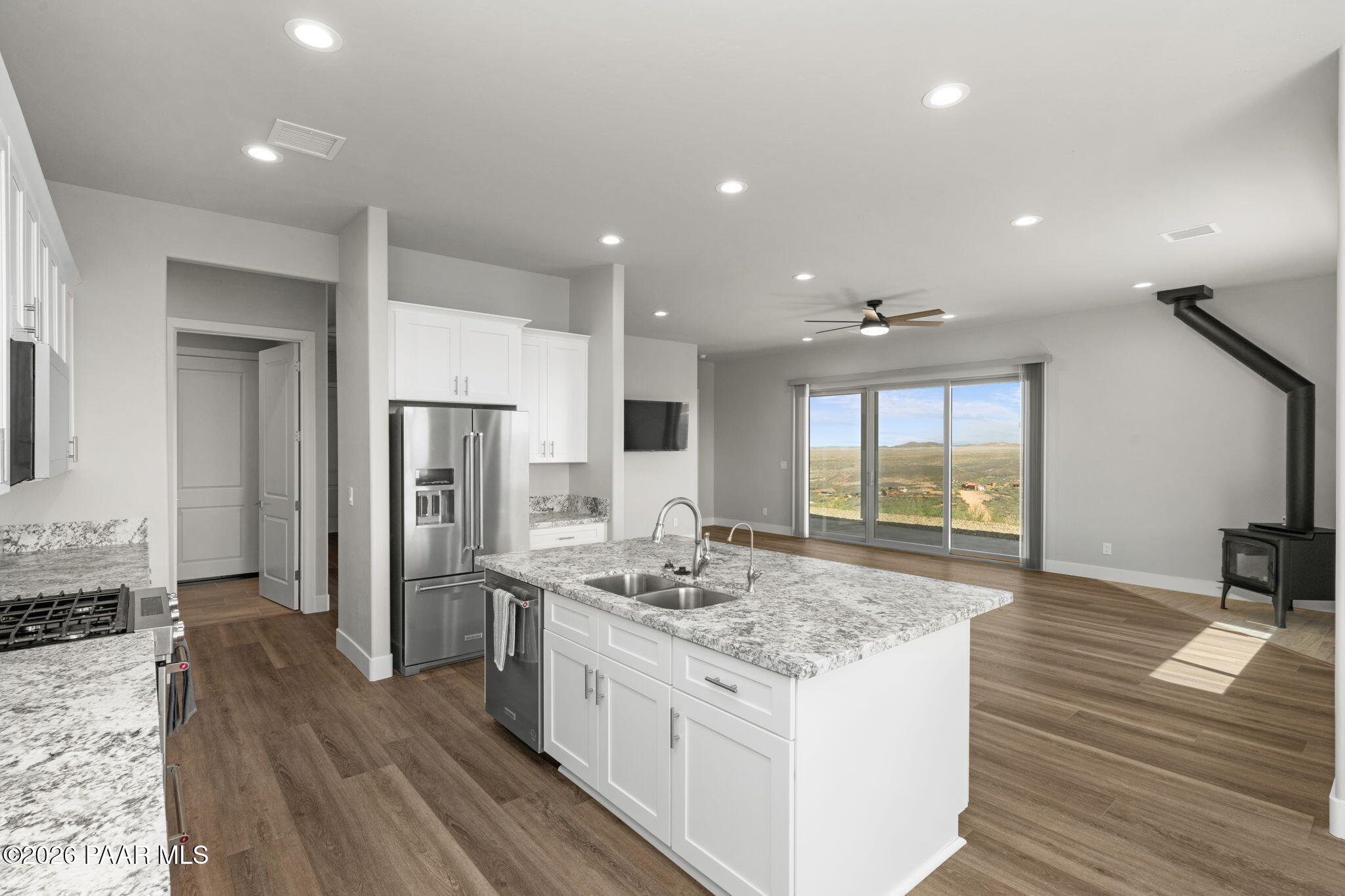 15690 East Orchard View Road Dewey, AZ 86327 - Photo 2 of 26 a kitchen with stainless steel appliances granite countertop a sink stove and refrigerator