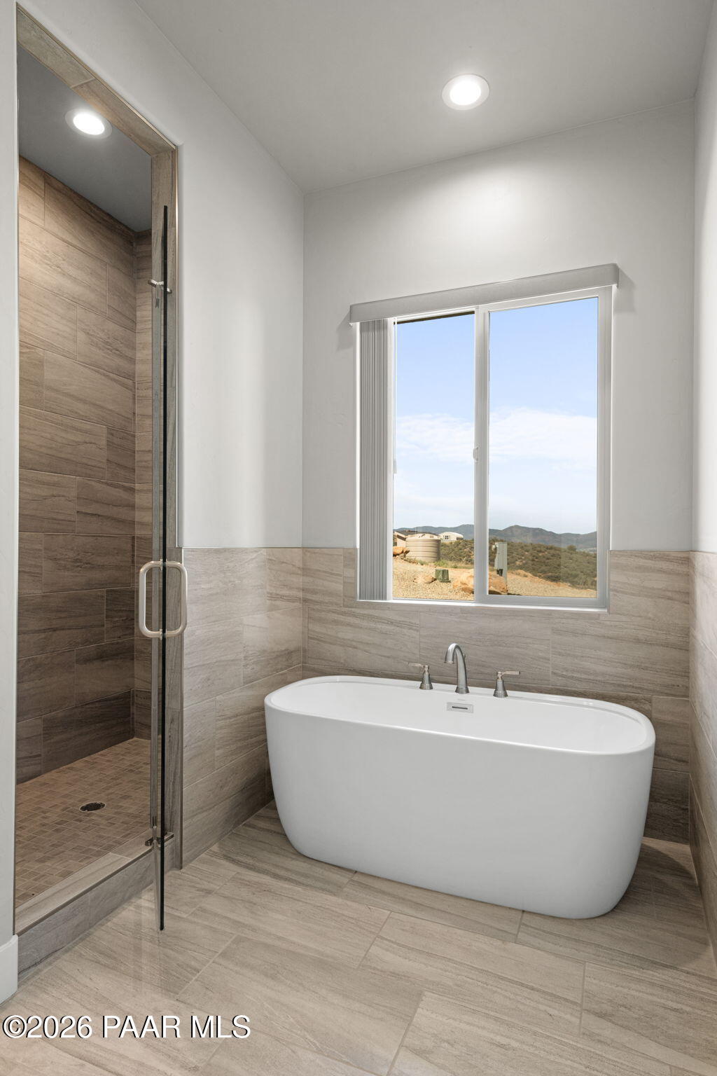 15690 East Orchard View Road Dewey, AZ 86327 - Photo 21 of 26 a bathroom with a bathtub and shower