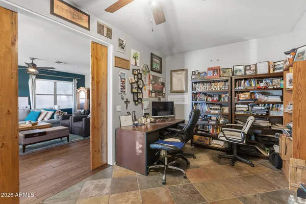 a view of a workspace with furniture and toys