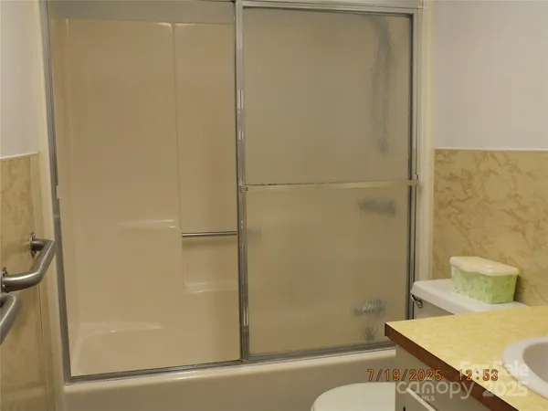 a bathroom with a sink and a shower