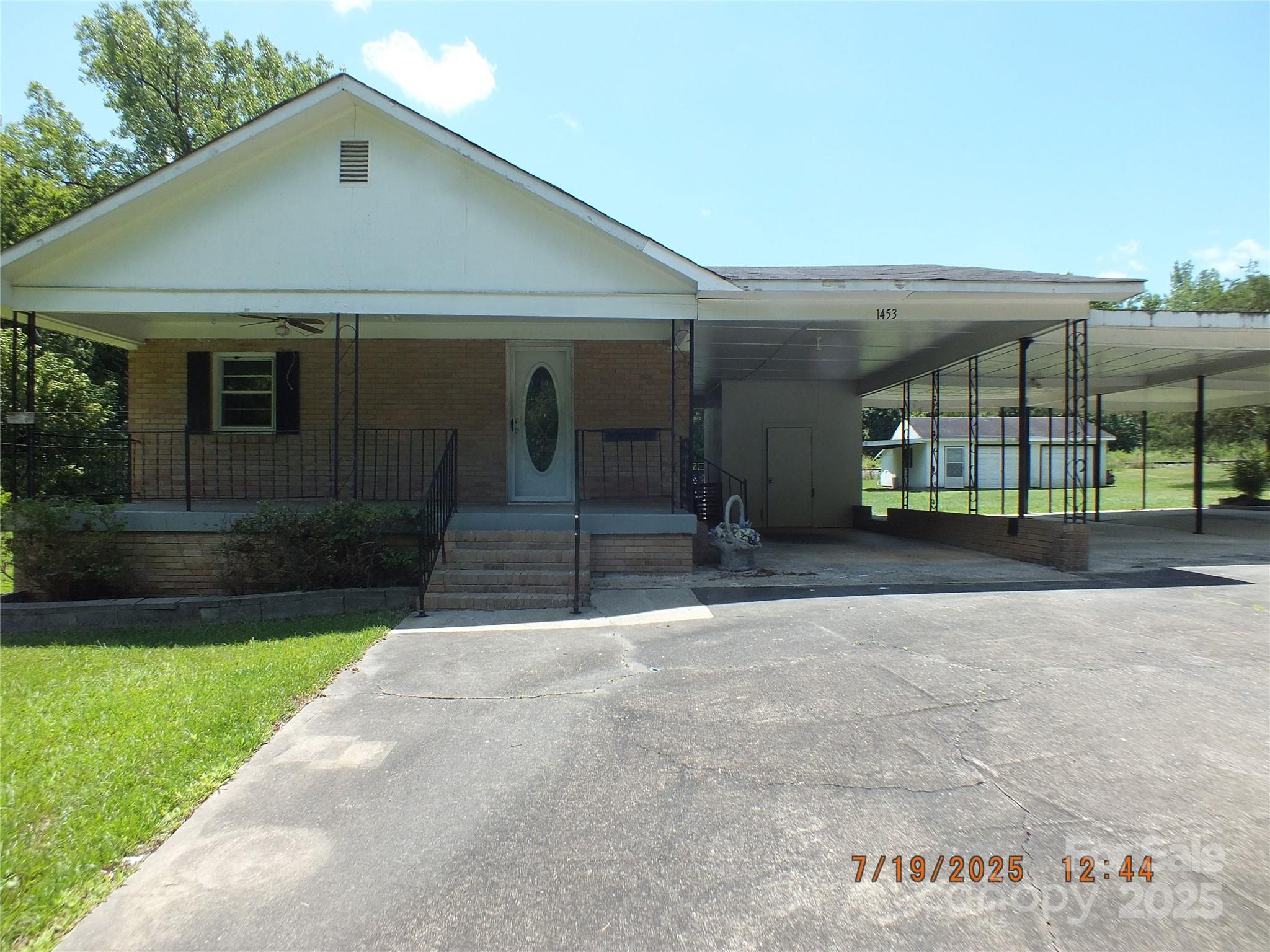 1453 Old Landsford Road Lancaster, SC 29720 - Photo 2 of 39 a front view of a house with garden