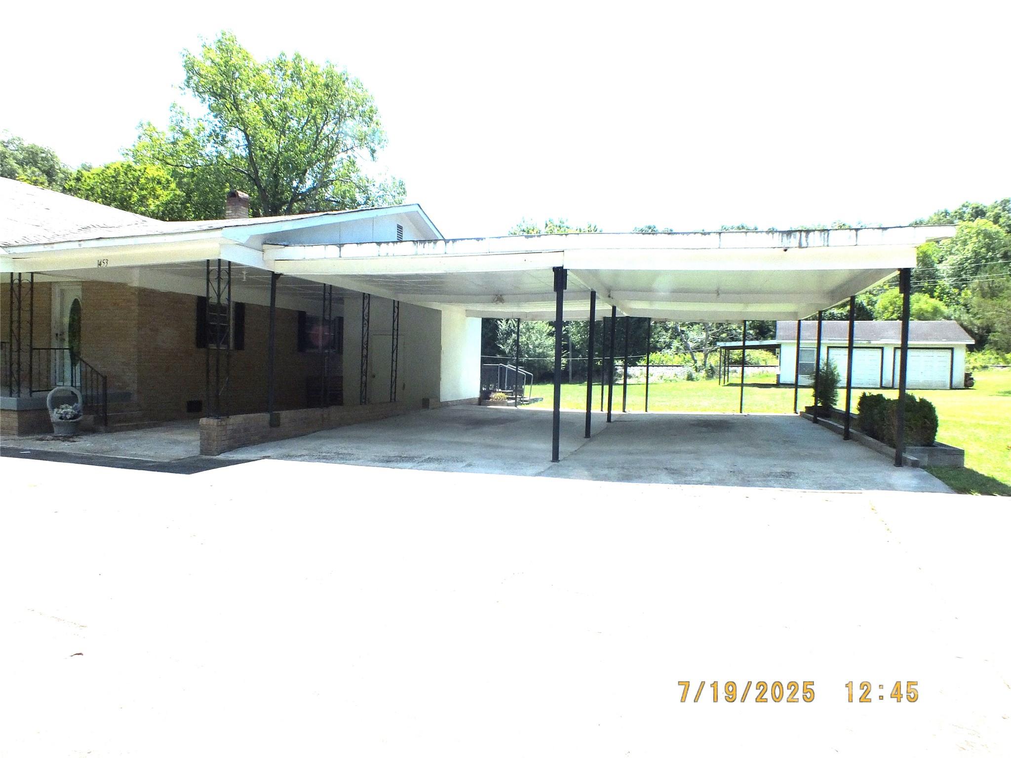 1453 Old Landsford Road Lancaster, SC 29720 - Photo 36 of 39 a view of a patio with table and chairs with wooden floor and fence