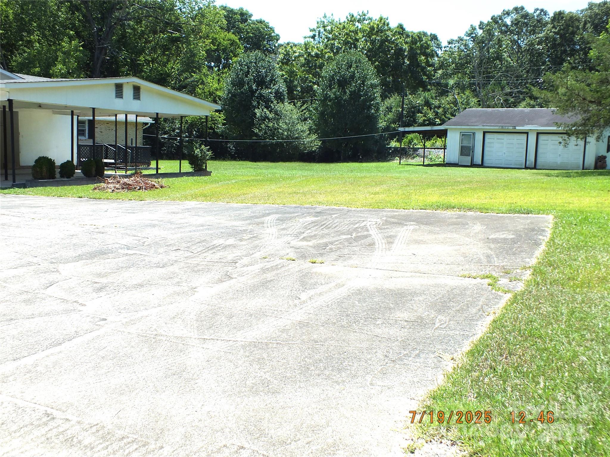 1453 Old Landsford Road Lancaster, SC 29720 - Photo 38 of 39 a swimming pool with outdoor seating and yard