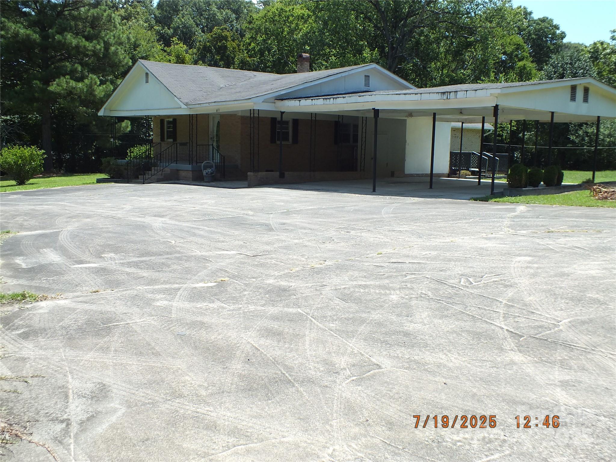 1453 Old Landsford Road Lancaster, SC 29720 - Photo 39 of 39 a front view of a house with a yard and car parked