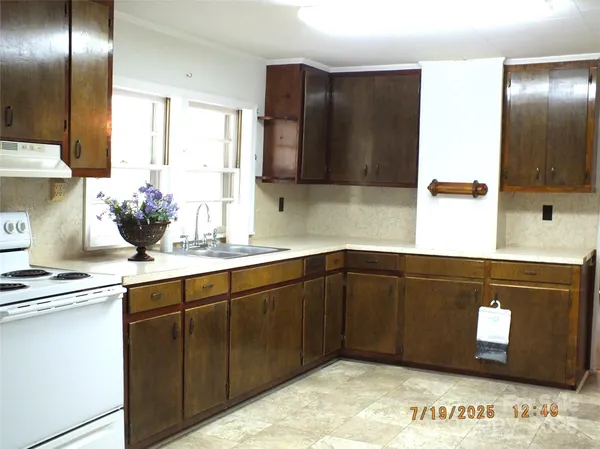 a kitchen with a sink and a window