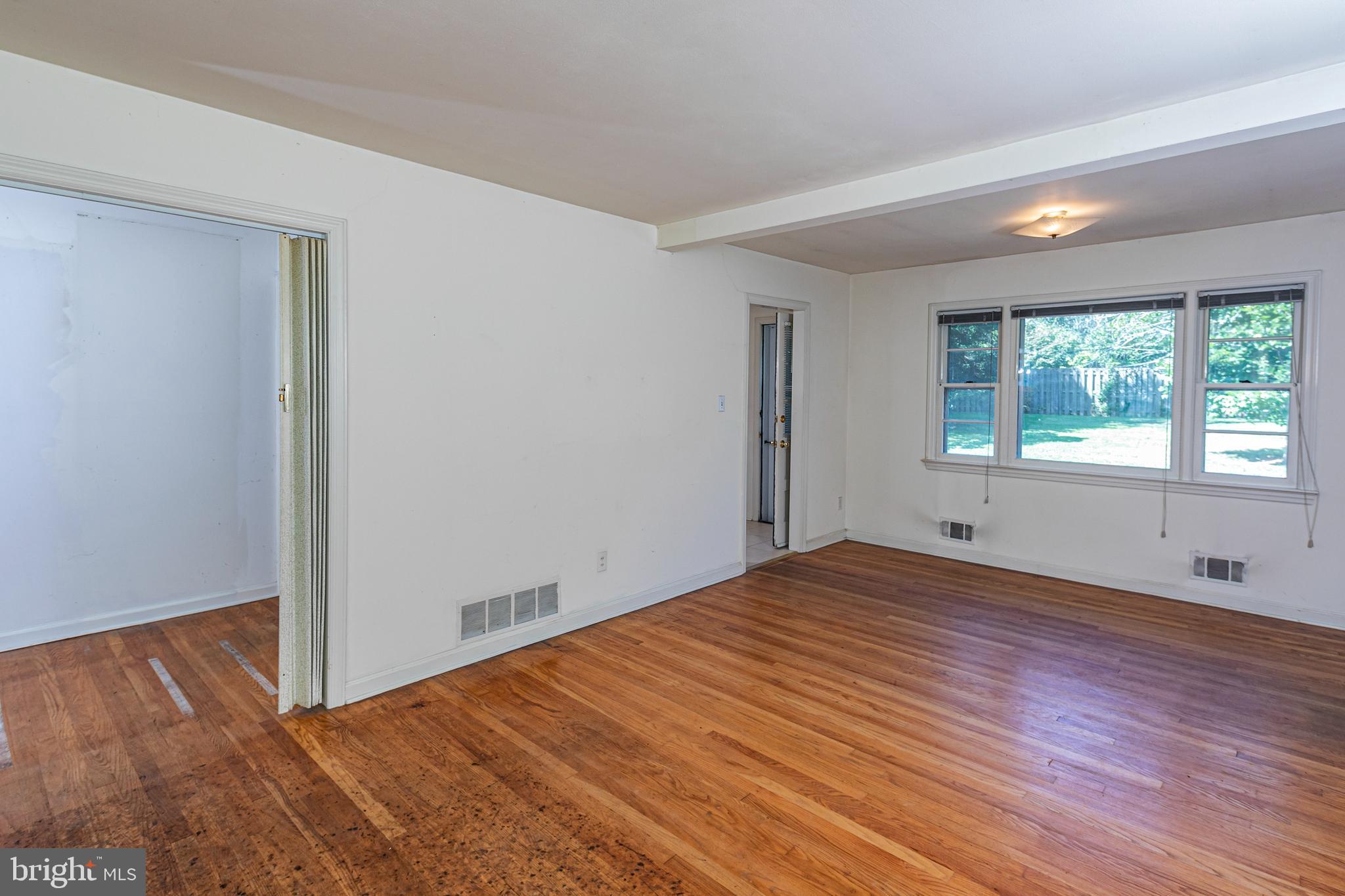 50 Broadripple Drive Princeton, NJ 08540 - Photo 6 of 17 a view of empty room with wooden floor and fan