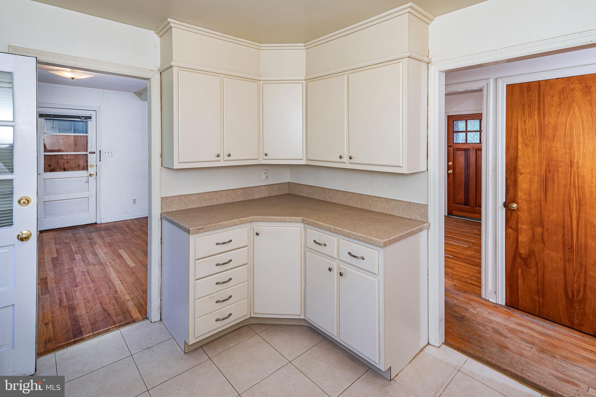 50 Broadripple Drive Princeton, NJ 08540 - Photo 8 of 17 a kitchen with white cabinets and a stove top oven