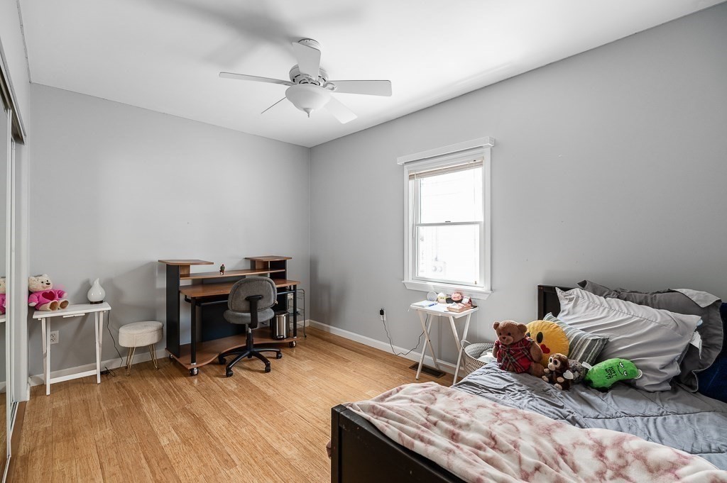 28 Gregg Street Beverly, MA 01915 - Photo 11 of 31 a bedroom with bed and a window