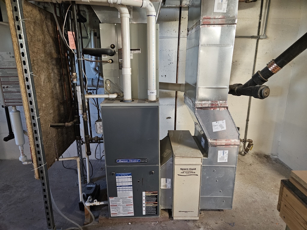28 Gregg Street Beverly, MA 01915 - Photo 20 of 31 a view of storage and utility room with stairs