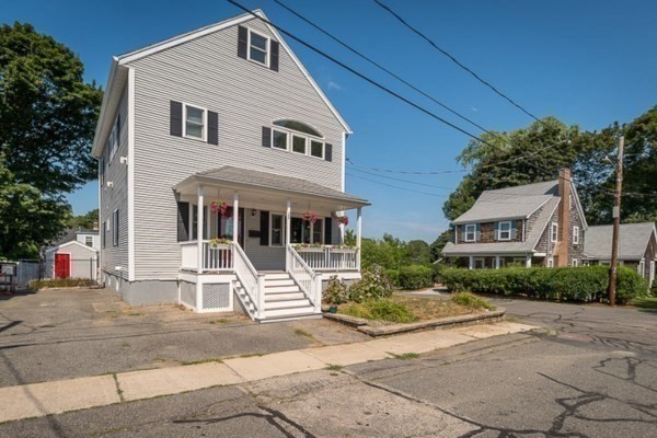28 Gregg Street Beverly, MA 01915 - Photo 2 of 31 a front view of a house with a yard