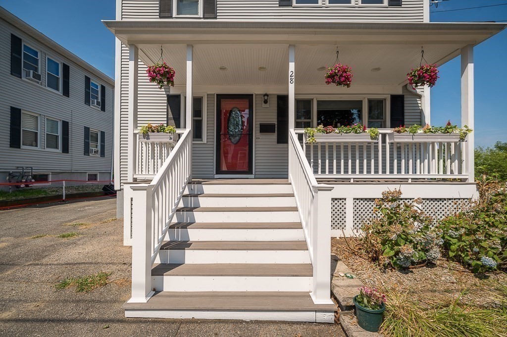 28 Gregg Street Beverly, MA 01915 - Photo 3 of 31 a front view of a house with entryway and stairs