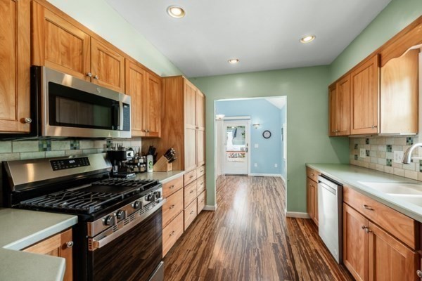 28 Gregg Street Beverly, MA 01915 - Photo 8 of 31 a kitchen with granite countertop a stove and a sink