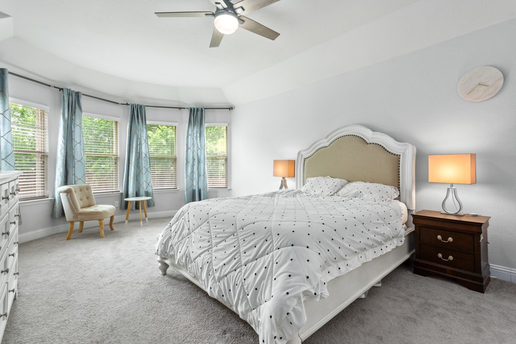 1916 Elaina Loop Leander, TX 78641 - Photo 14 of 23 a bedroom with a bed and a window
