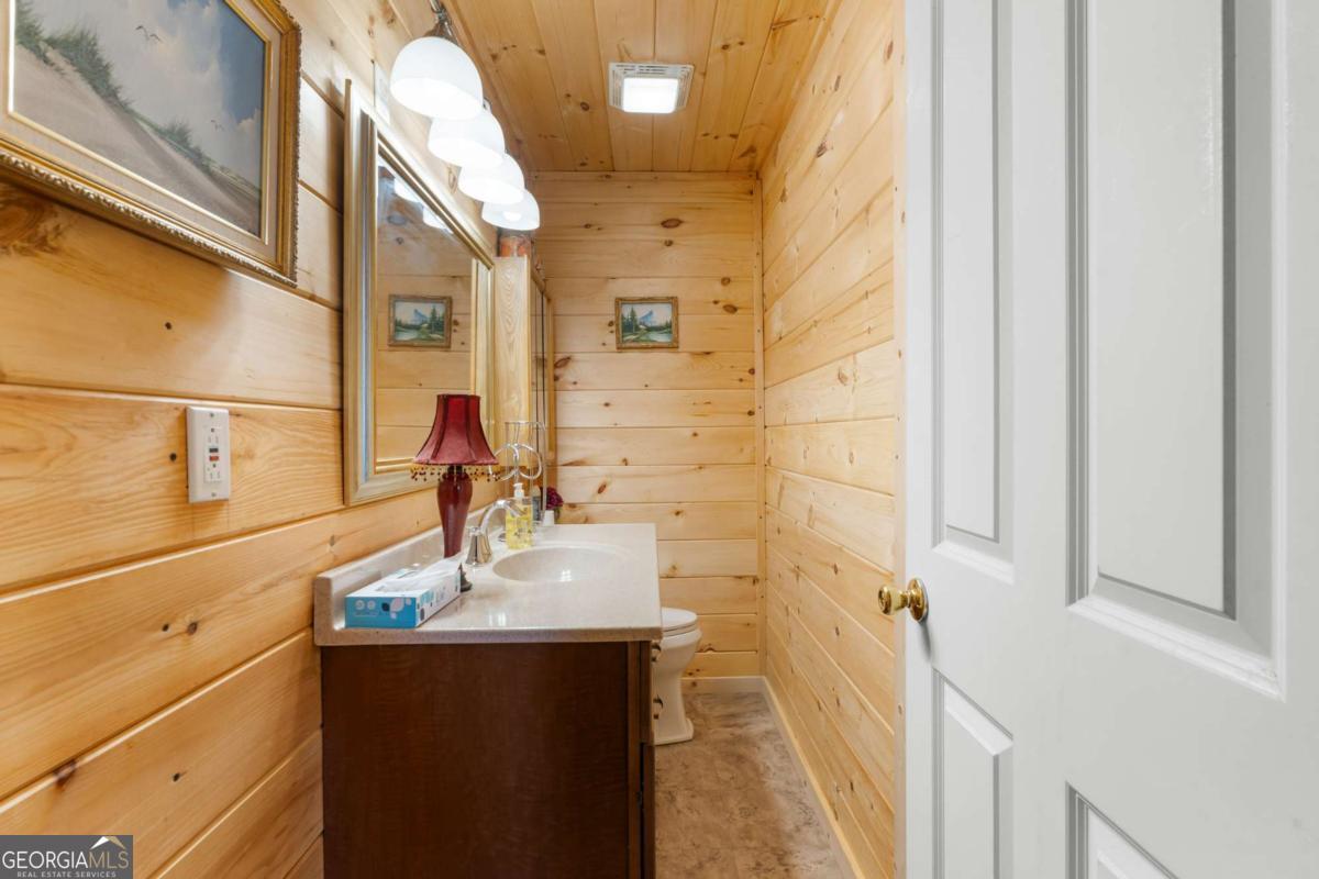 3516 Bennetts Landing Road Millen, GA 30442 - Photo 27 of 34 a bathroom with a sink and mirror