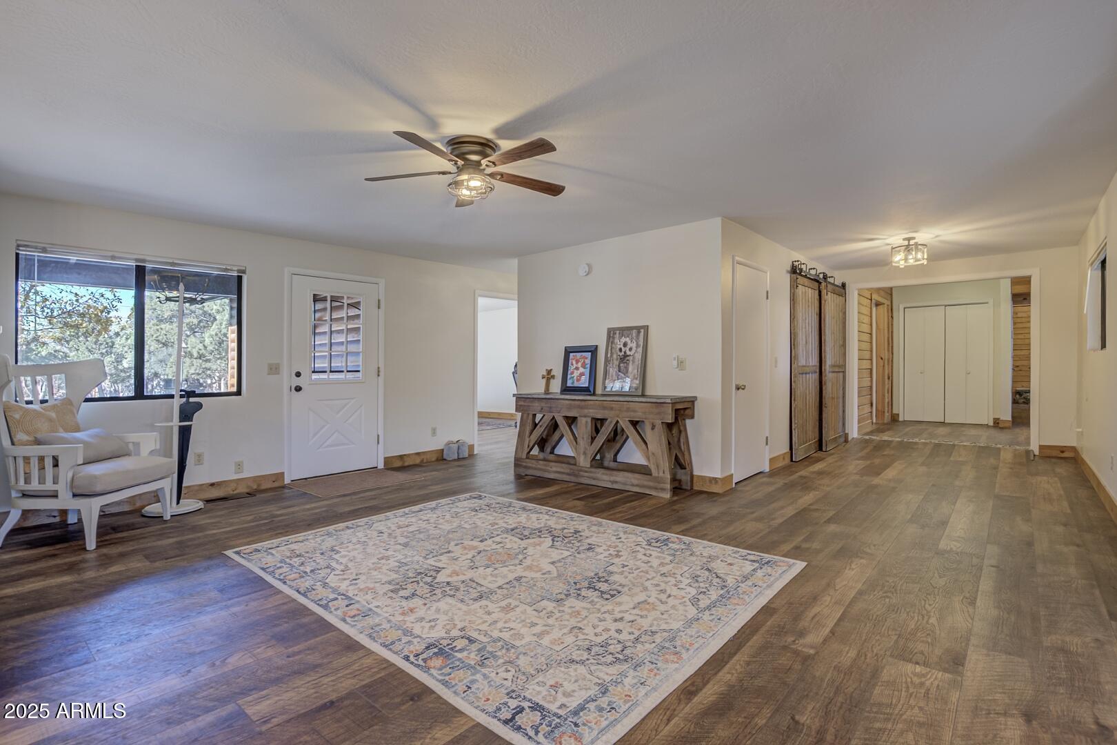 4823 Rim View Loop Pine, AZ 85544 - Photo 15 of 70 a living room with furniture and a wooden floor