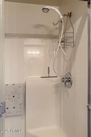 a living room with a fireplace and windows