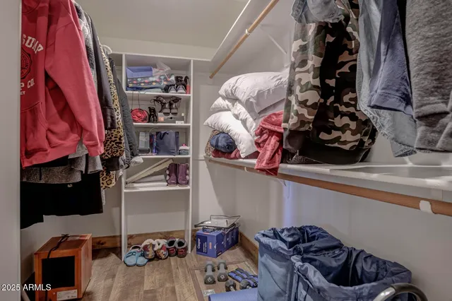a bathroom with a granite countertop toilet a sink and a mirror