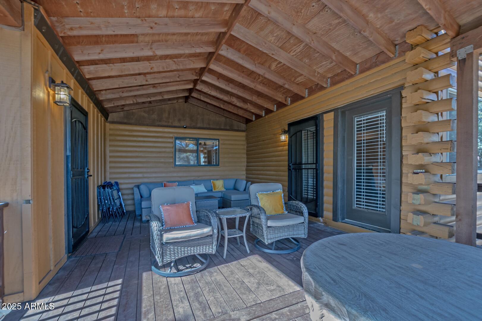 4823 Rim View Loop Pine, AZ 85544 - Photo 53 of 70 a balcony with furniture and wooden floor