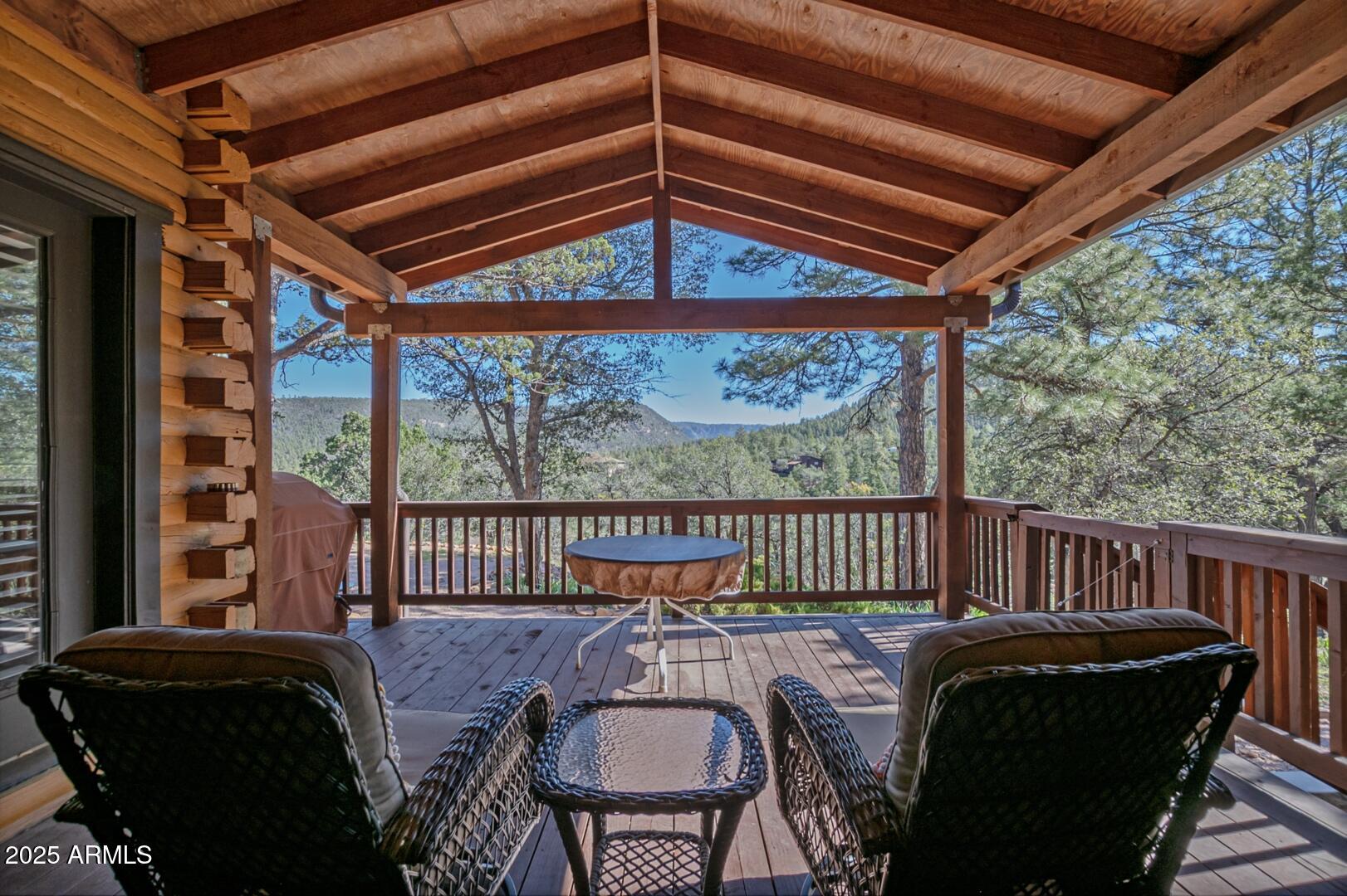 4823 Rim View Loop Pine, AZ 85544 - Photo 54 of 70 a view of a chair and table in the balcony