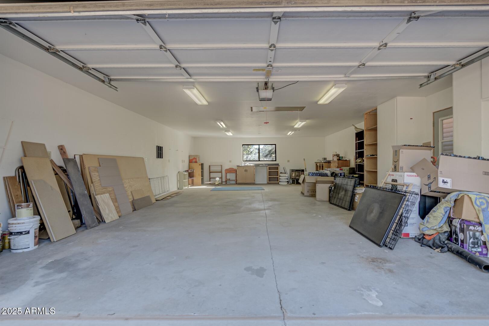 4823 Rim View Loop Pine, AZ 85544 - Photo 62 of 70 a view of a livingroom with furniture and a ceiling fan