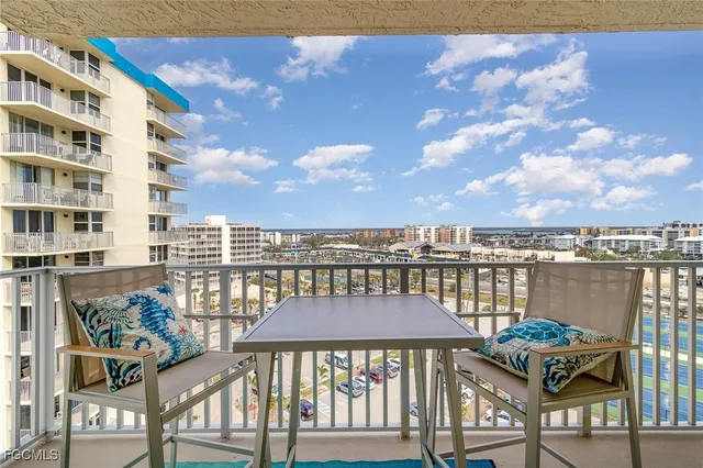 a view of a balcony with furniture