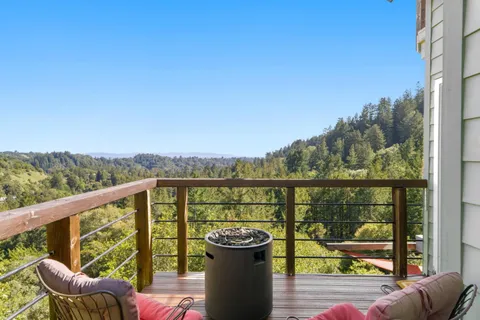 a view of a deck with mountain view and lake view