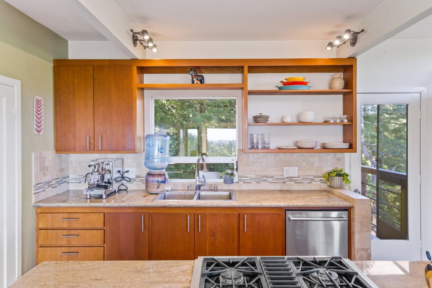540 Olaughlin Road Santa Cruz, CA 95065 - Photo 21 of 42 a kitchen with stainless steel appliances wooden cabinets a stove and a large window