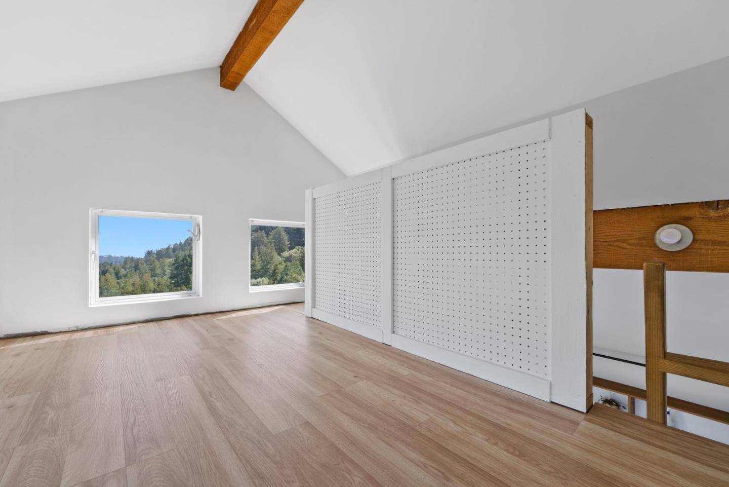 540 Olaughlin Road Santa Cruz, CA 95065 - Photo 29 of 42 an empty room with wooden floor and window