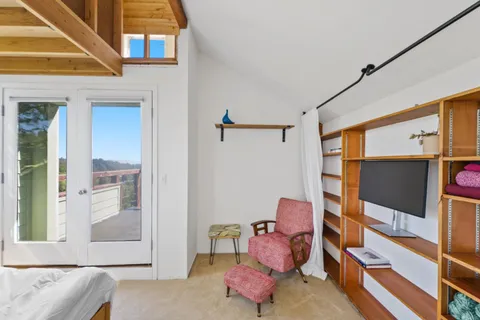 a view of a city with lush green forest