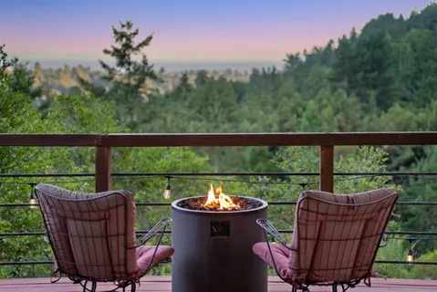 an aerial view of a house with swimming pool and garden view