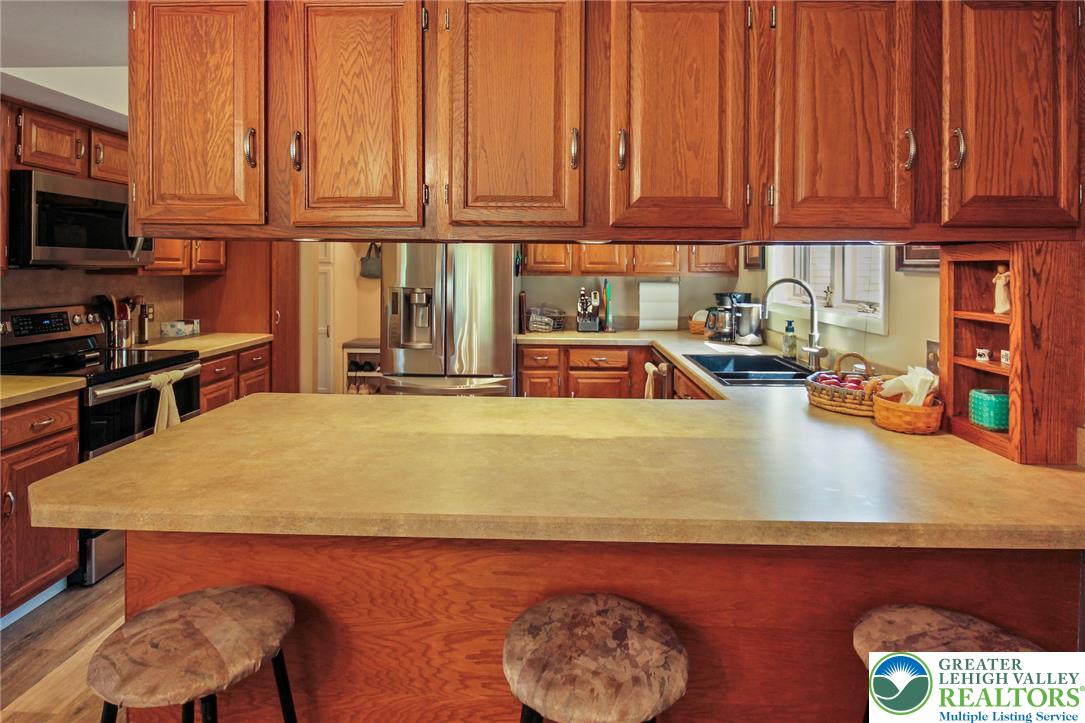 3470 Brodhead Road Bethlehem, PA 18020 - Photo 43 of 84 A warm and inviting kitchen featuring ample cabinetry and a practical breakfast bar.