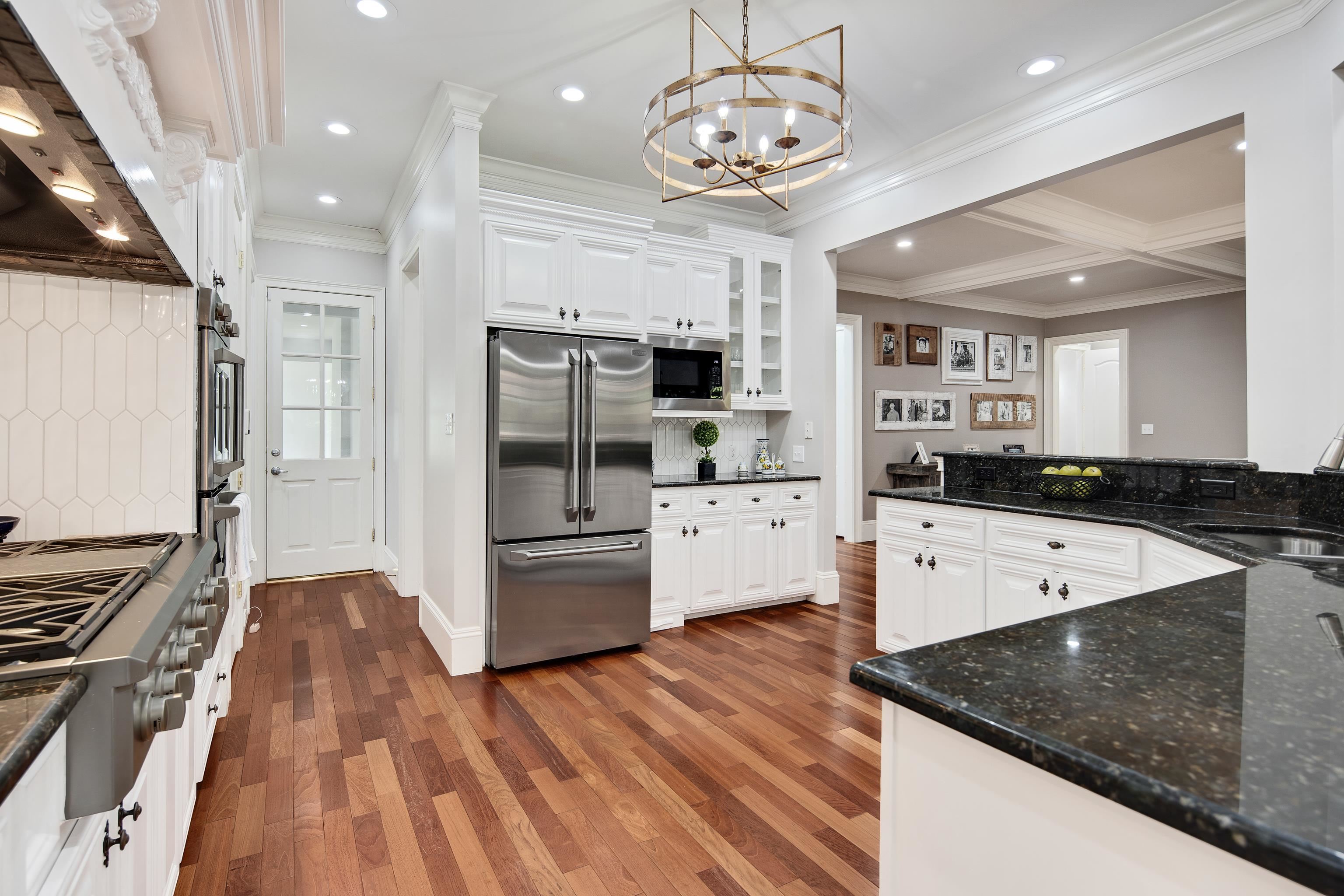 159 Lynn Road Eads, TN 38028 - Photo 14 of 40 Sparkling Kitchen featuring white cabinetry, White Picket Backsplash and stainless steel Monogram Gas Range, Double Ovens, Microwave, Refrigerator, Dishwasher and Scottsman Pellet Ice Maker (AKA. Sonic Ice)