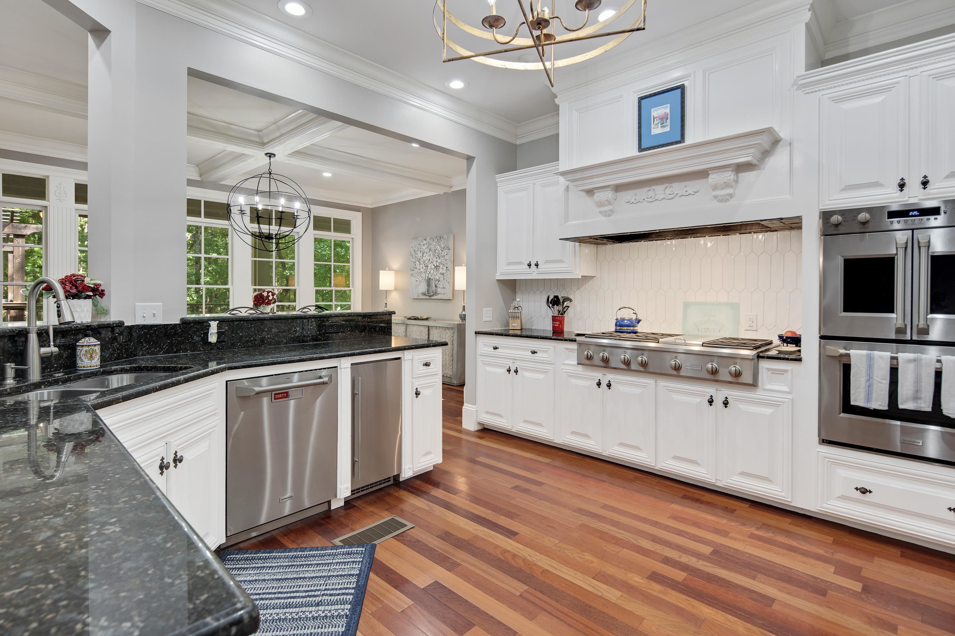 159 Lynn Road Eads, TN 38028 - Photo 15 of 40 Sparkling Kitchen featuring white cabinetry, White Picket Backsplash and stainless steel Monogram Gas Range, Double Ovens, Microwave, Refrigerator, Dishwasher and Scottsman Pellet Ice Maker (AKA. Sonic Ice)
