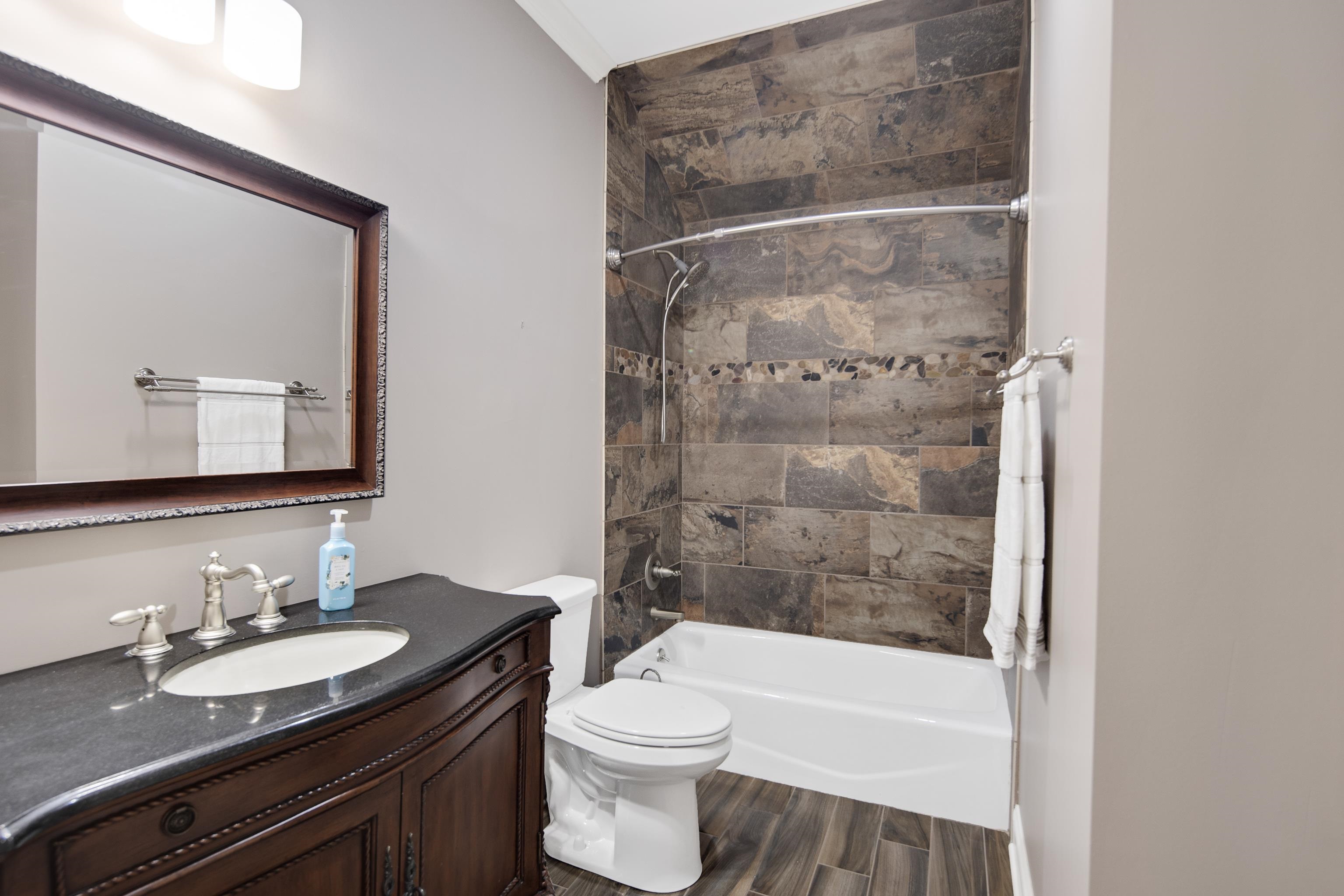 159 Lynn Road Eads, TN 38028 - Photo 24 of 40 4th Full Bath, Services the 5th Bedroom, Bonus Room and Loft upstairs! Another Renovated Bath with new Lighting, Elegant tile work, a tub and a furniture-style Vanity!