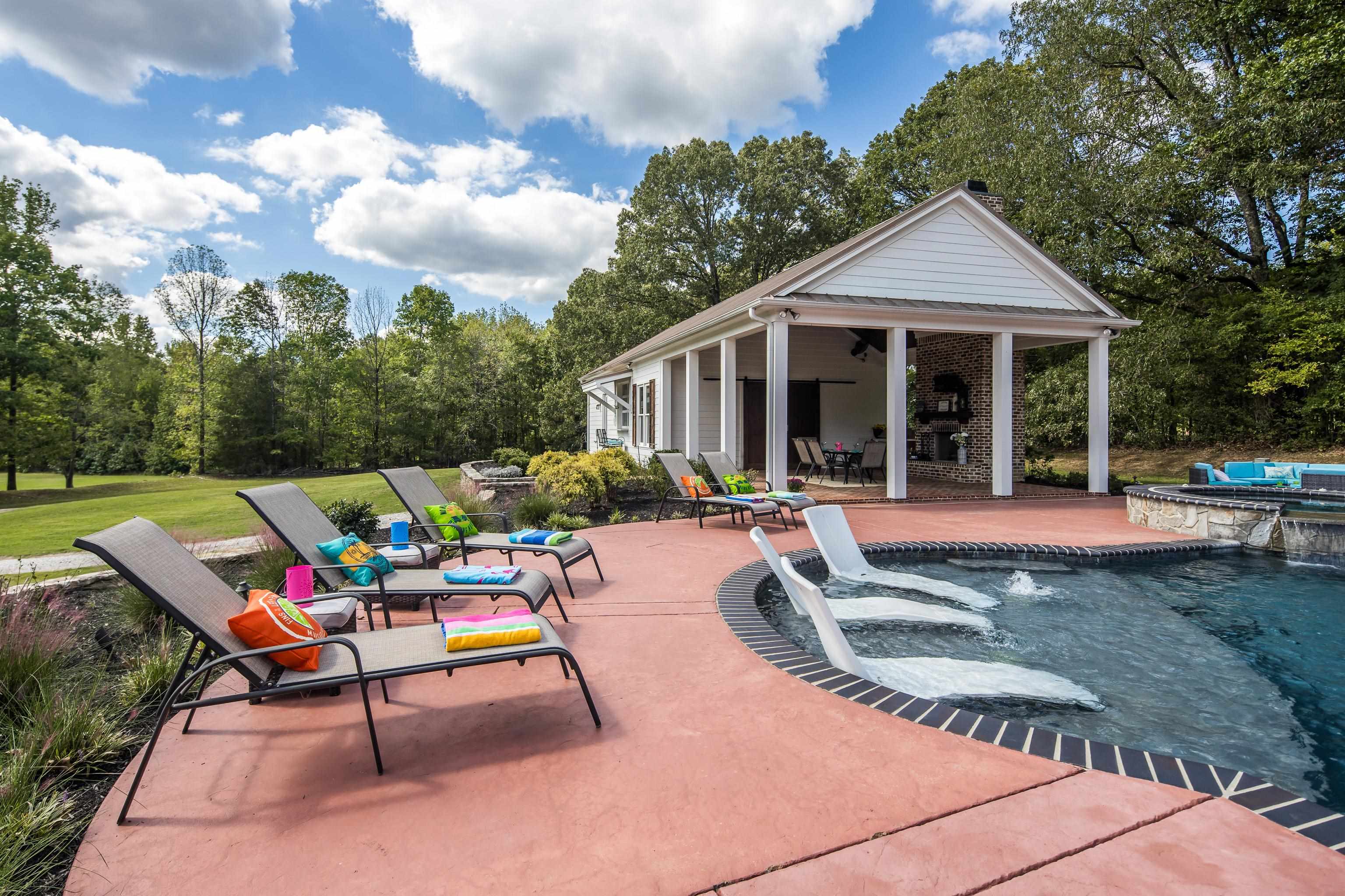 159 Lynn Road Eads, TN 38028 - Photo 33 of 40 Close up view of the tanning ledge with Jets for springs of water to cool you off on a hot day! The Pool Deck offers ample space for lounge chairs and guests to visit without getting wet!