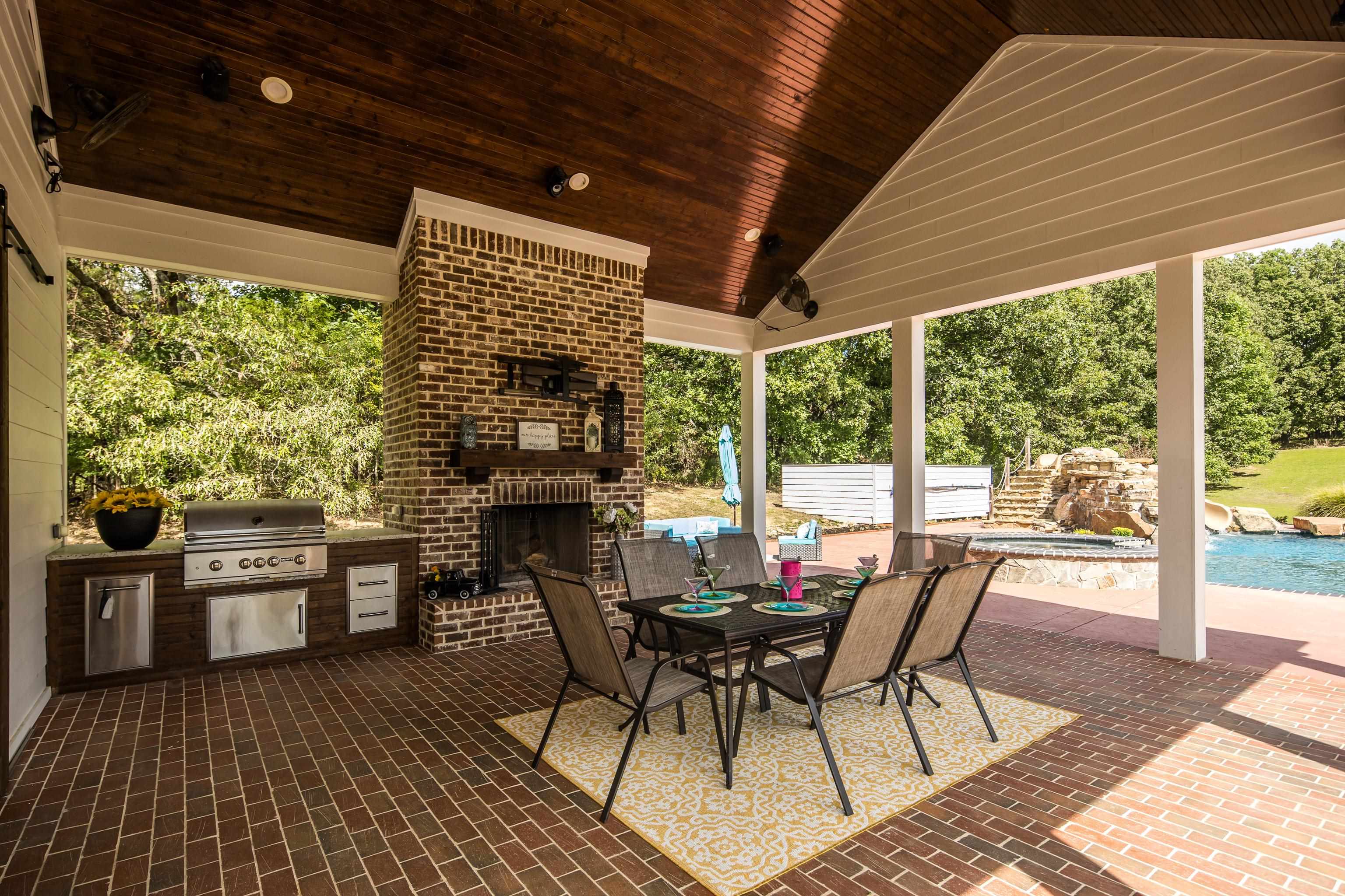 159 Lynn Road Eads, TN 38028 - Photo 34 of 40 Find Shade under the Vaulted Pavilion which features a Built-in Gas Grill so you can BBQ near the kitchen, a Wood Burning Fireplace w/ a beautiful Hearth and wired for surround sound so you can set any mood!