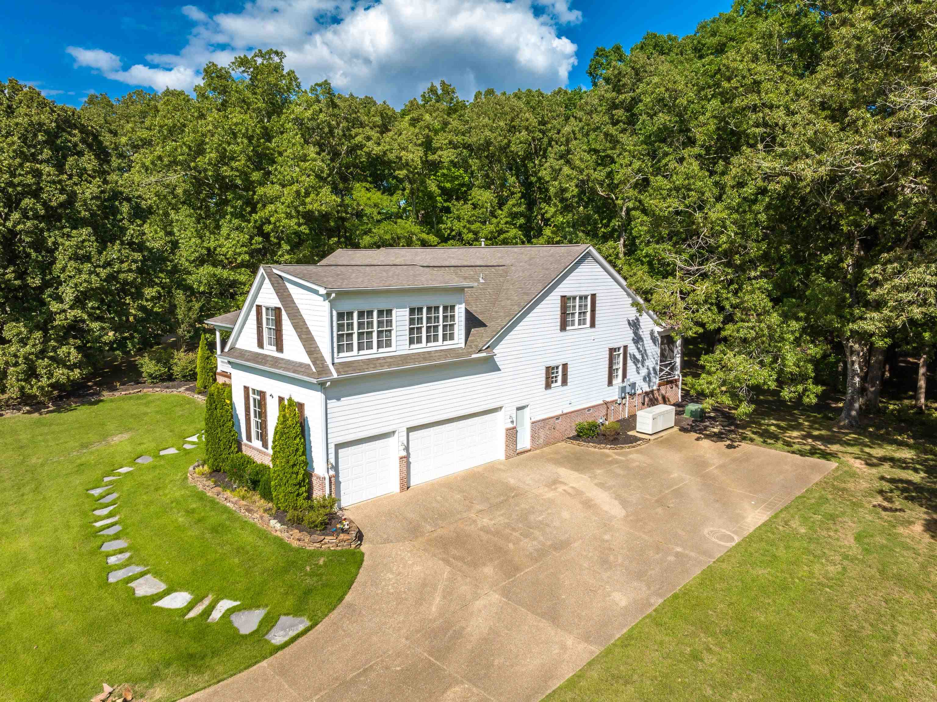 159 Lynn Road Eads, TN 38028 - Photo 5 of 40 3 Car side load garage. Hardie Plank Siding, Architectural Roof was installed in 2021.