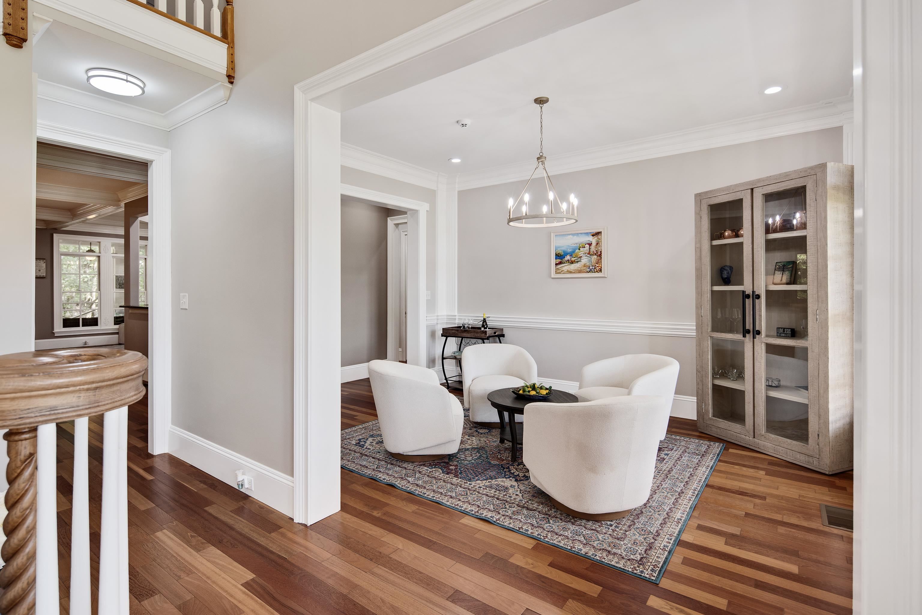 159 Lynn Road Eads, TN 38028 - Photo 7 of 40 Sitting room with an inviting chandelier, ornamental molding, and dark hardwood / wood-style flooring