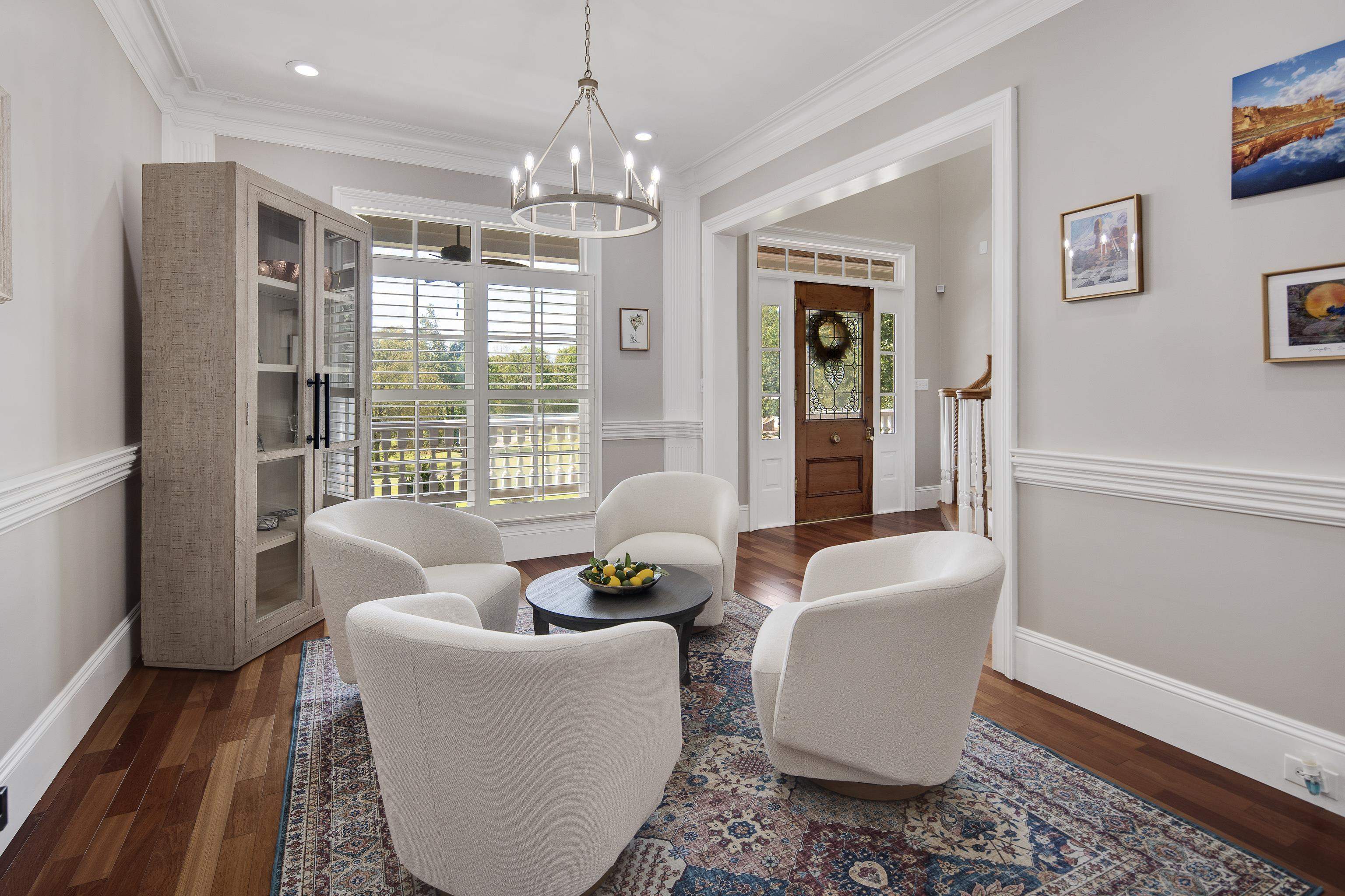 159 Lynn Road Eads, TN 38028 - Photo 8 of 40 Living area featuring ornamental molding, dark hardwood / wood-style flooring, and a chandelier with Plantation Shutters