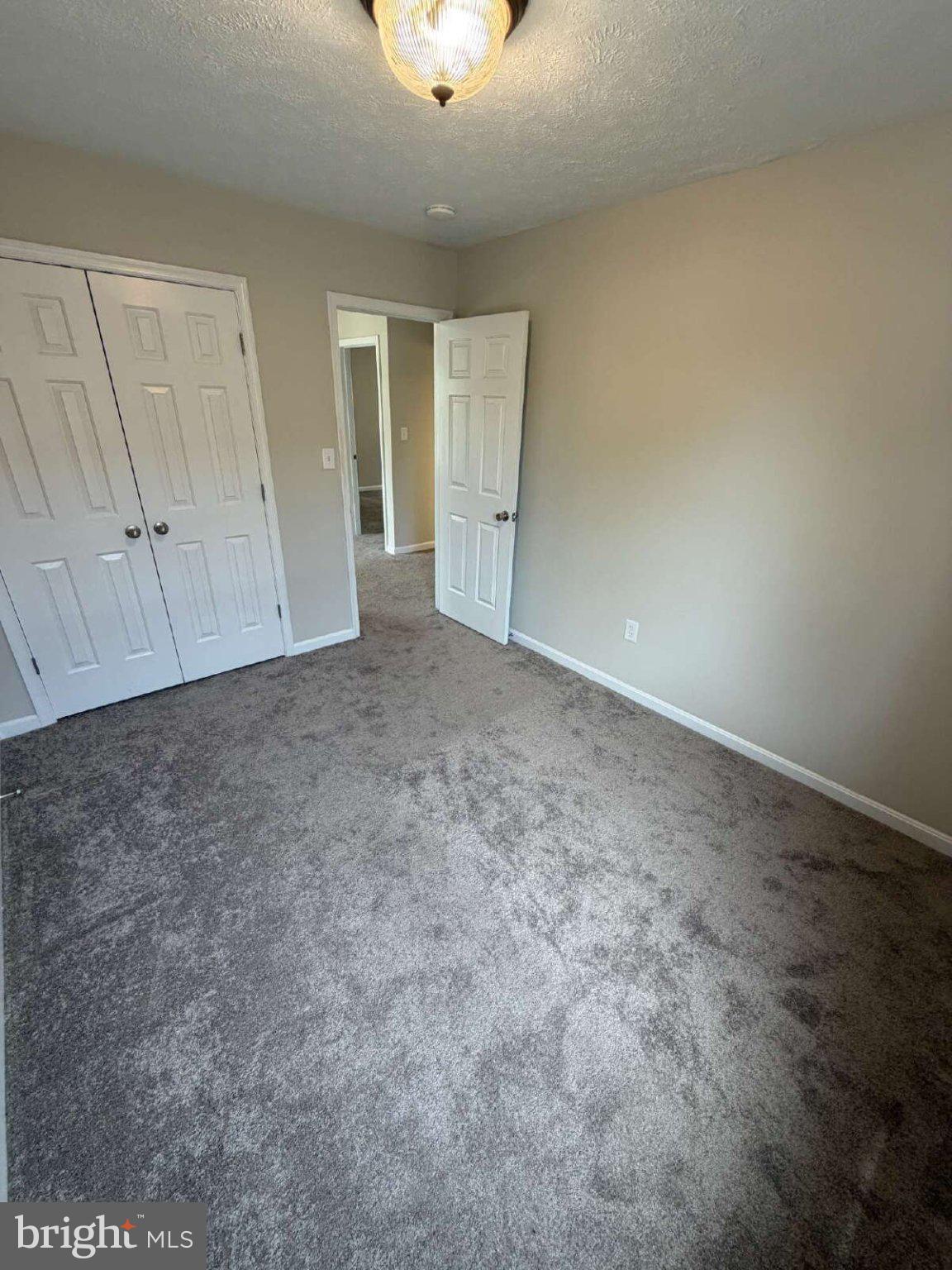 313 3rd Street Colonial Beach, VA 22443 - Photo 18 of 36 Spacious room with inviting light.