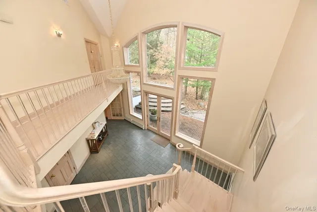 a view of entryway with wooden floor and windows